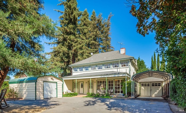 1436 Pine St, Napa, CA 94559 - view of front of property featuring a carport, a chimney, a porch, an outbuilding, and a storage unit