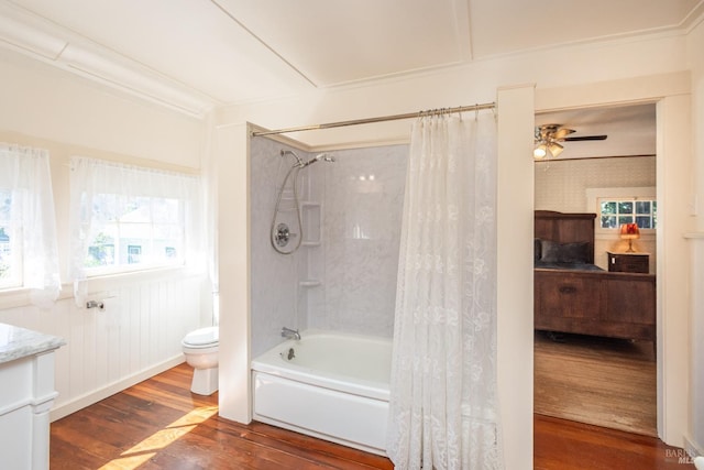 1436 Pine St, Napa, CA 94559 - ensuite bathroom with a ceiling fan, a wainscoted wall, toilet, shower / bathtub combination with curtain, and wood-type flooring