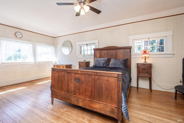 1436 Pine St, Napa, CA 94559 - bedroom featuring multiple windows, light wood-type flooring, and wallpapered walls