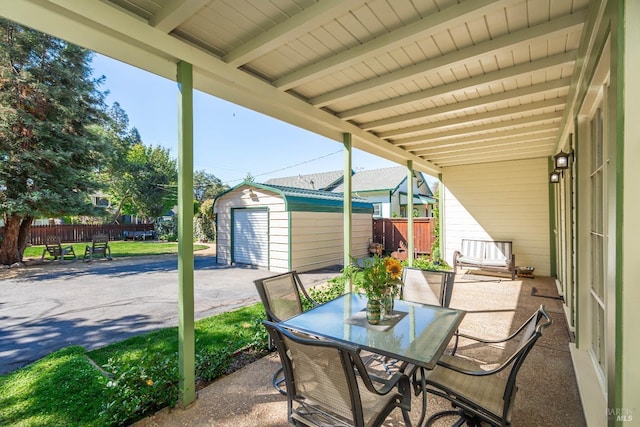 1436 Pine St, Napa, CA 94559 - view of patio featuring an outbuilding, outdoor dining space, fence, and a shed