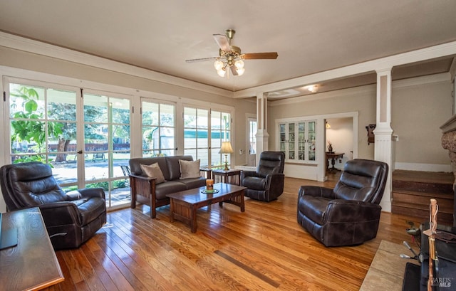 1436 Pine St, Napa, CA 94559 - living room featuring light wood-style flooring, crown molding, ceiling fan, and decorative columns