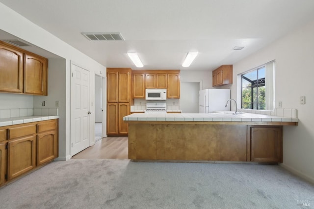 220 Sandy Neck Way, Vallejo, CA 94591 - kitchen featuring white appliances, a sink, light carpet, a peninsula, and tile countertops