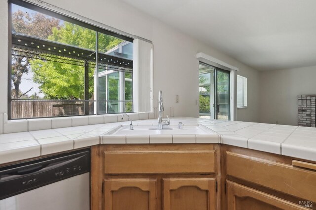 220 Sandy Neck Way, Vallejo, CA 94591 - kitchen featuring dishwasher, plenty of natural light, a sink, and brown cabinets