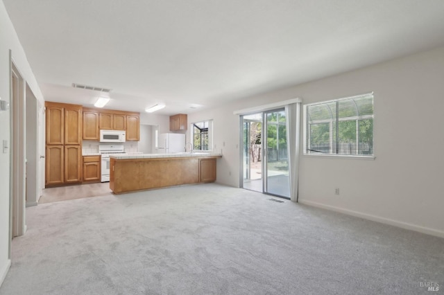 220 Sandy Neck Way, Vallejo, CA 94591 - kitchen featuring white appliances, light countertops, light carpet, a peninsula, and open floor plan