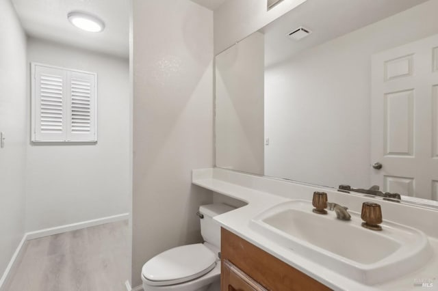 220 Sandy Neck Way, Vallejo, CA 94591 - bathroom featuring vanity, toilet, baseboards, and wood finished floors