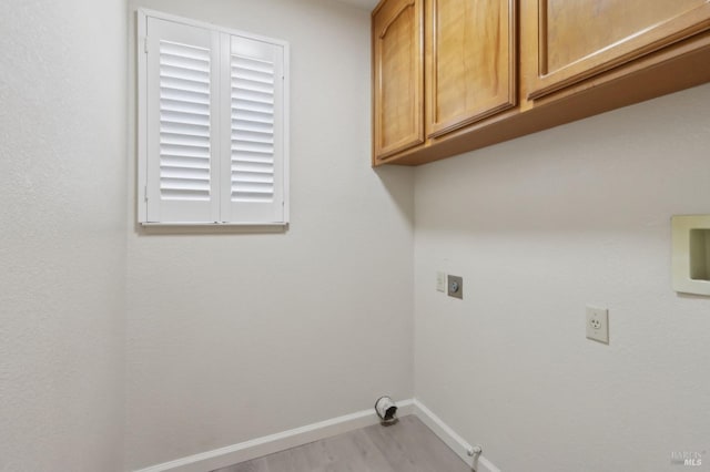 220 Sandy Neck Way, Vallejo, CA 94591 - laundry area featuring electric dryer hookup, cabinet space, baseboards, light wood-style flooring, and hookup for a gas dryer