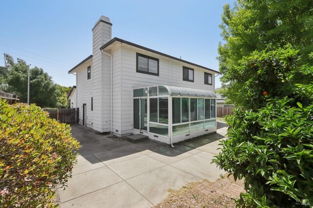 220 Sandy Neck Way, Vallejo, CA 94591 - back of property with a sunroom, a chimney, and a patio