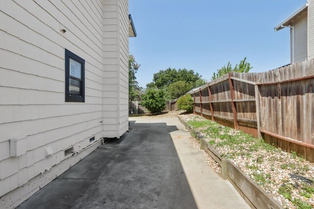 220 Sandy Neck Way, Vallejo, CA 94591 - view of side of home featuring a fenced backyard, a patio area, and crawl space