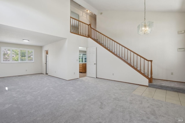 220 Sandy Neck Way, Vallejo, CA 94591 - unfurnished living room with carpet, a chandelier, stairway, tile patterned floors, and a high ceiling