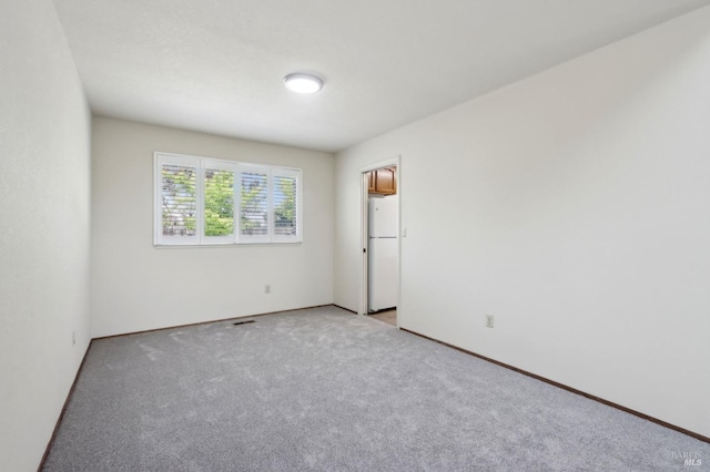 220 Sandy Neck Way, Vallejo, CA 94591 - unfurnished bedroom featuring freestanding refrigerator, light carpet, and baseboards