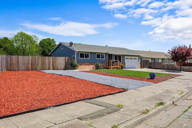 ranch-style house featuring brick siding, an attached garage, fence, and driveway