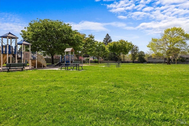 communal playground featuring a yard
