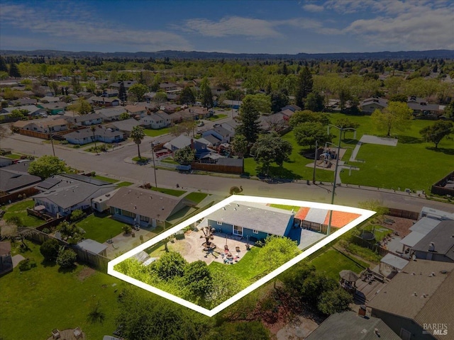 birds eye view of property with a residential view