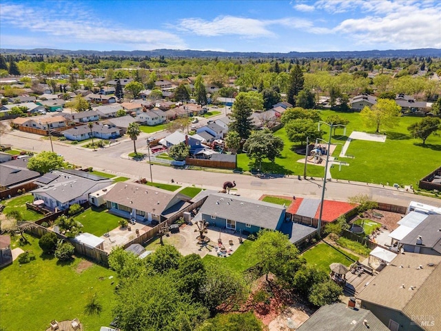 birds eye view of property with a residential view
