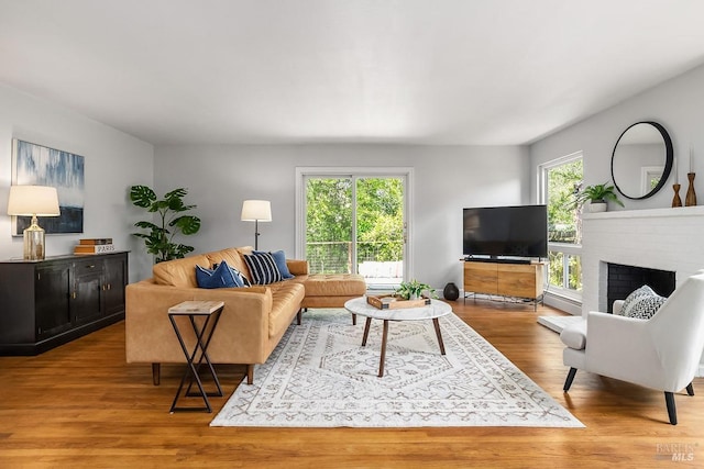 436 Calle De La Mesa, Novato, CA 94949 - living area with wood finished floors and a brick fireplace