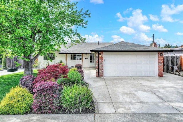 ranch-style house with a shingled roof, a garage, fence, brick siding, and driveway