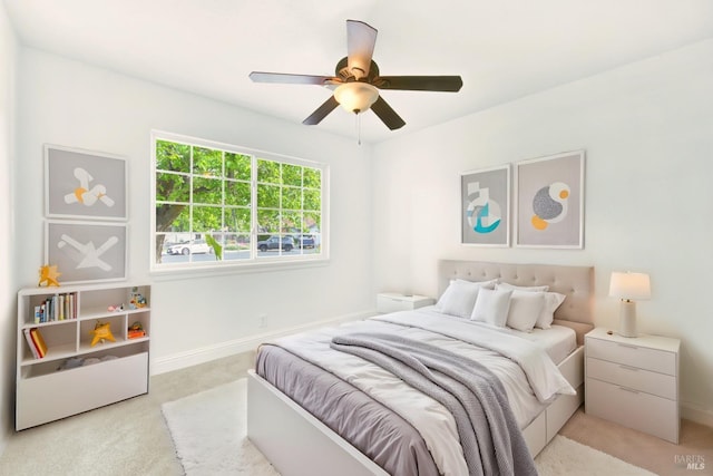 bedroom featuring baseboards, carpet flooring, and ceiling fan