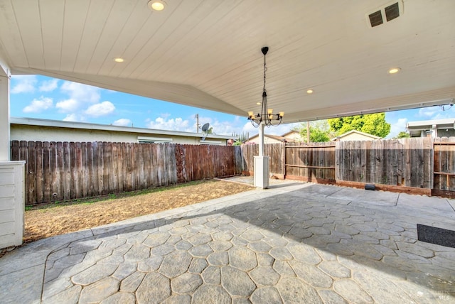 view of patio / terrace with a fenced backyard and visible vents