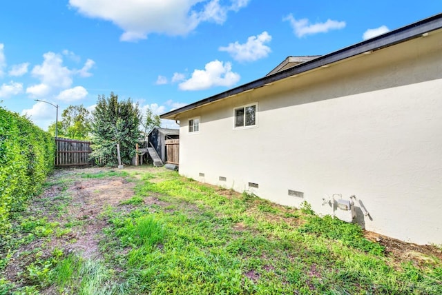 exterior space with a fenced backyard