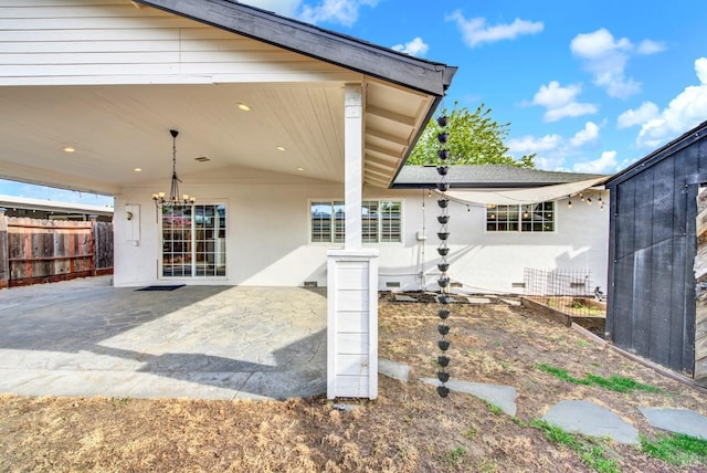exterior space featuring a patio, stucco siding, and fence
