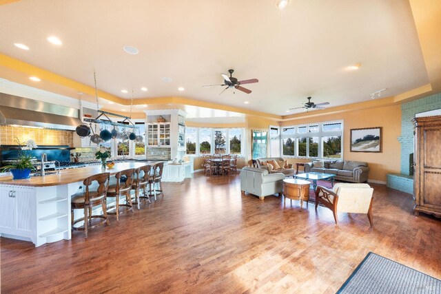 2614 Scotts Right Of Way, Sebastopol, CA 95472 - living room featuring arched walkways, ceiling fan, dark wood-style floors, a tray ceiling, and recessed lighting