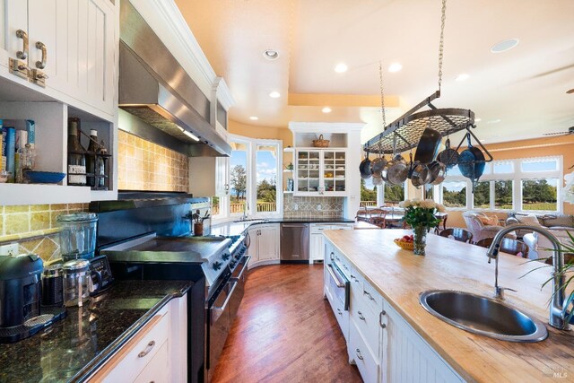 2614 Scotts Right Of Way, Sebastopol, CA 95472 - kitchen with wall chimney range hood, backsplash, and open shelves