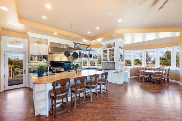 2614 Scotts Right Of Way, Sebastopol, CA 95472 - kitchen with open shelves, white cabinets, arched walkways, a center island, and recessed lighting