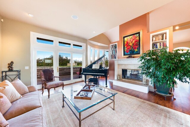 2614 Scotts Right Of Way, Sebastopol, CA 95472 - living area with arched walkways, wood finished floors, and a tiled fireplace