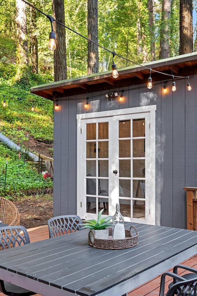 wooden terrace with outdoor dining space