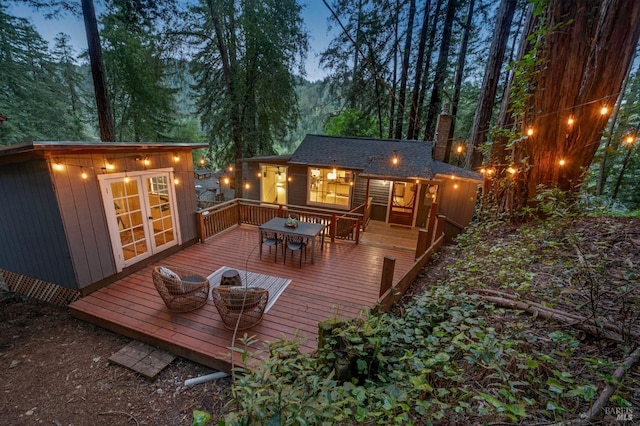 wooden terrace with outdoor dining area