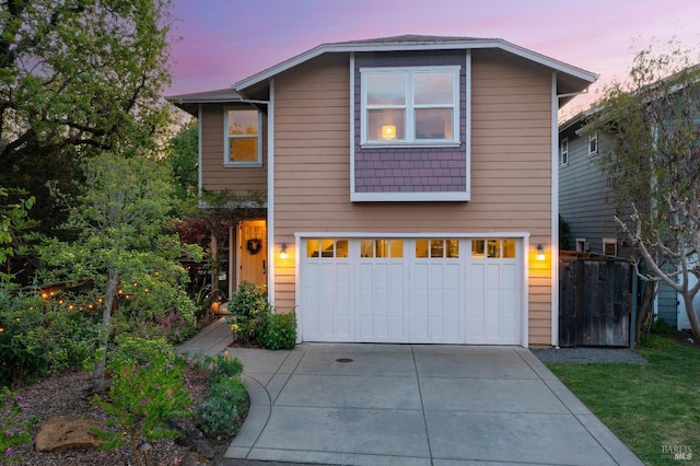 traditional-style house with a garage and driveway