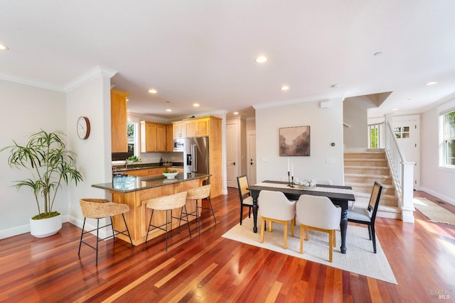dining room with baseboards, ornamental molding, recessed lighting, dark wood-style floors, and stairs
