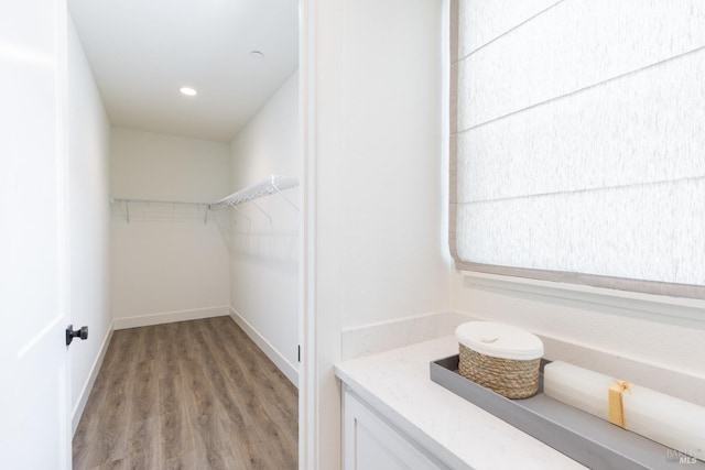 walk in closet featuring light wood-style floors
