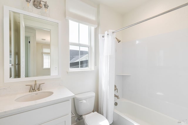 full bathroom featuring shower / tub combo, vanity, and toilet