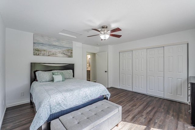bedroom with dark wood-style flooring, a closet, baseboards, and a ceiling fan