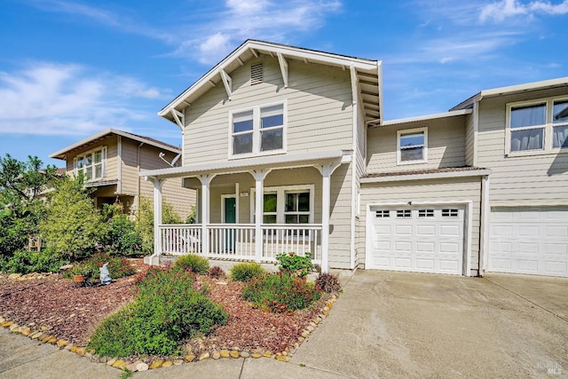 view of front of house featuring concrete driveway, a porch, and a garage