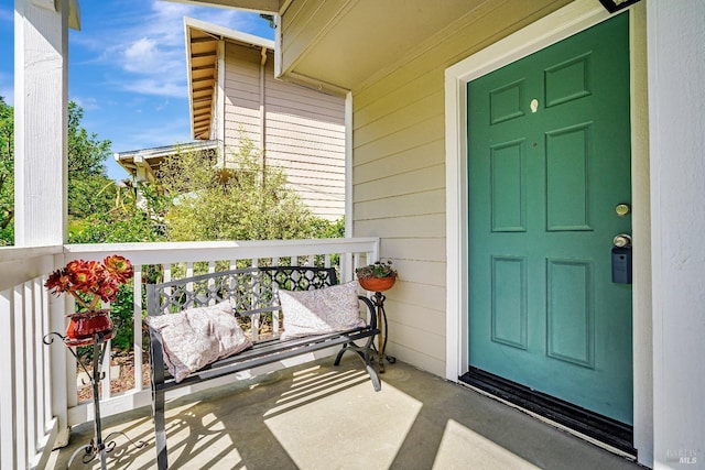 doorway to property featuring a porch