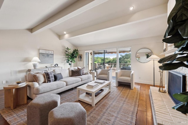 living room with baseboards, vaulted ceiling with beams, and wood finished floors
