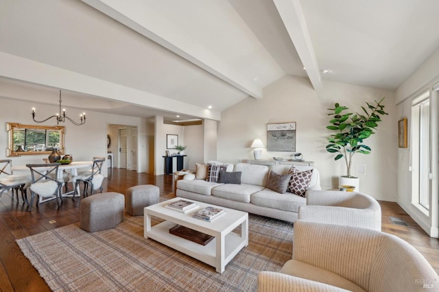 living room featuring visible vents, vaulted ceiling with beams, a notable chandelier, and wood finished floors