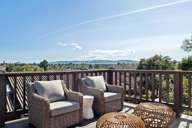 wooden deck featuring a mountain view