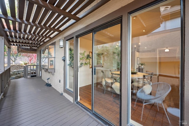 wooden deck featuring a pergola