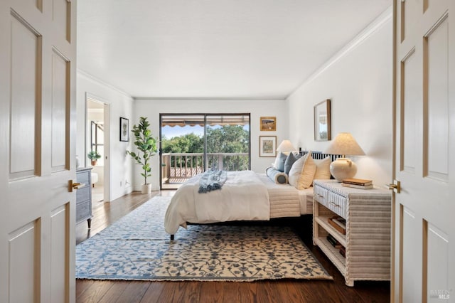 bedroom featuring dark wood-type flooring, access to exterior, and ornamental molding