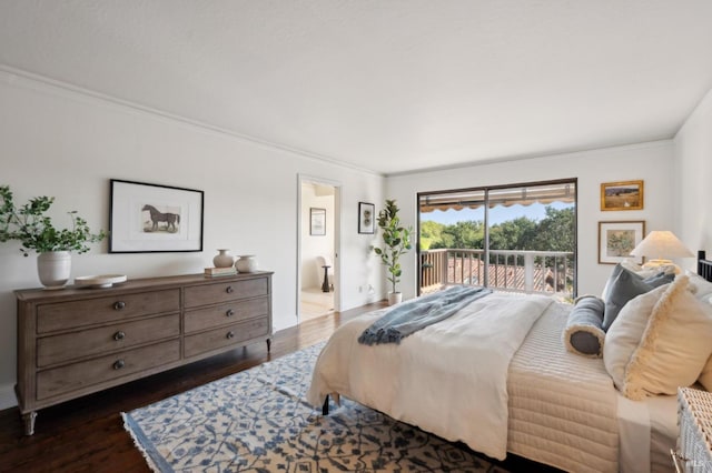 bedroom with dark wood-style flooring, ornamental molding, access to exterior, and connected bathroom