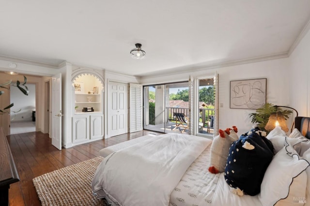 bedroom with hardwood / wood-style flooring, access to exterior, and ornamental molding