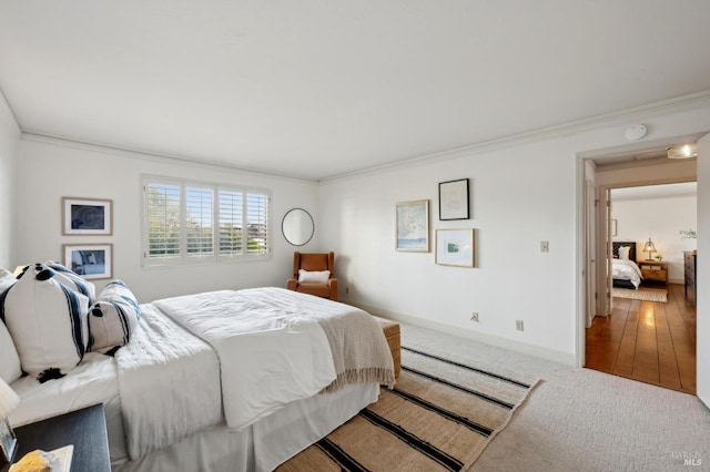 carpeted bedroom with baseboards and crown molding