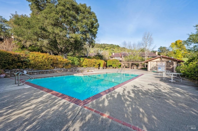 outdoor pool with a patio