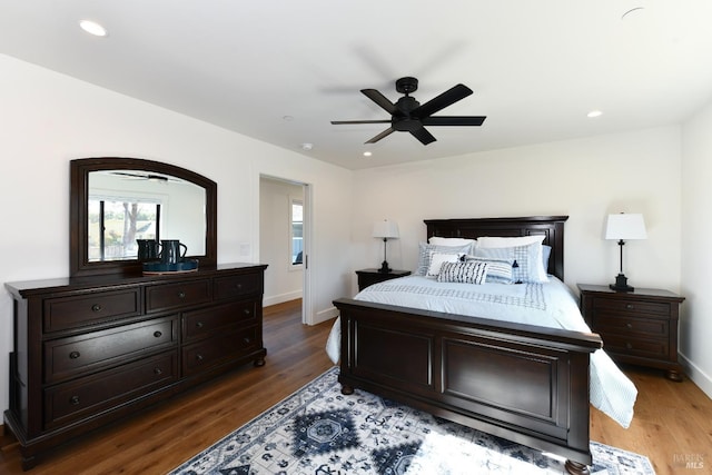 bedroom featuring wood finished floors, a ceiling fan, recessed lighting, and baseboards
