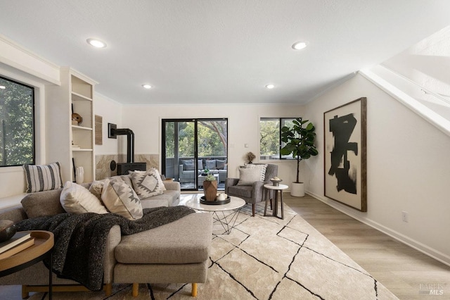 19 Savannah Ave, San Anselmo, CA 94960 - living room with a wood stove, light wood-type flooring, recessed lighting, and baseboards