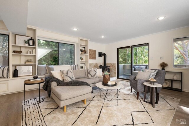 19 Savannah Ave, San Anselmo, CA 94960 - living area featuring ornamental molding, a wood stove, light wood finished floors, and recessed lighting