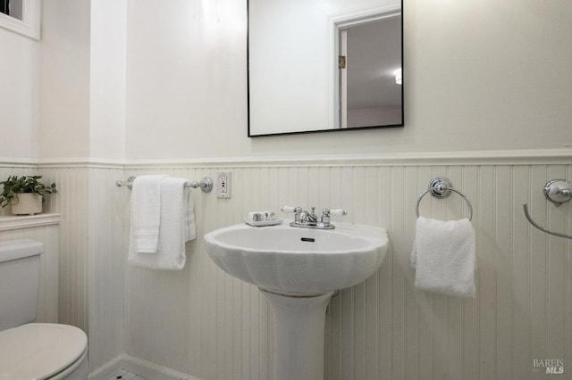 19 Savannah Ave, San Anselmo, CA 94960 - half bathroom featuring toilet and a wainscoted wall